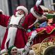 Santa Claus waves to the crowd during the Macy’s Thanksgiving Day Parade on Nov. 27, 2014 in New York City.